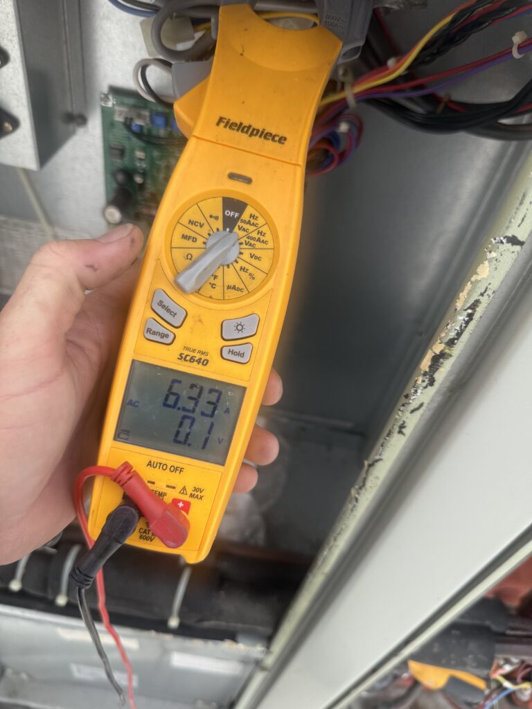 Fieldpiece meter readings taken during commercial rooftop unit maintenance