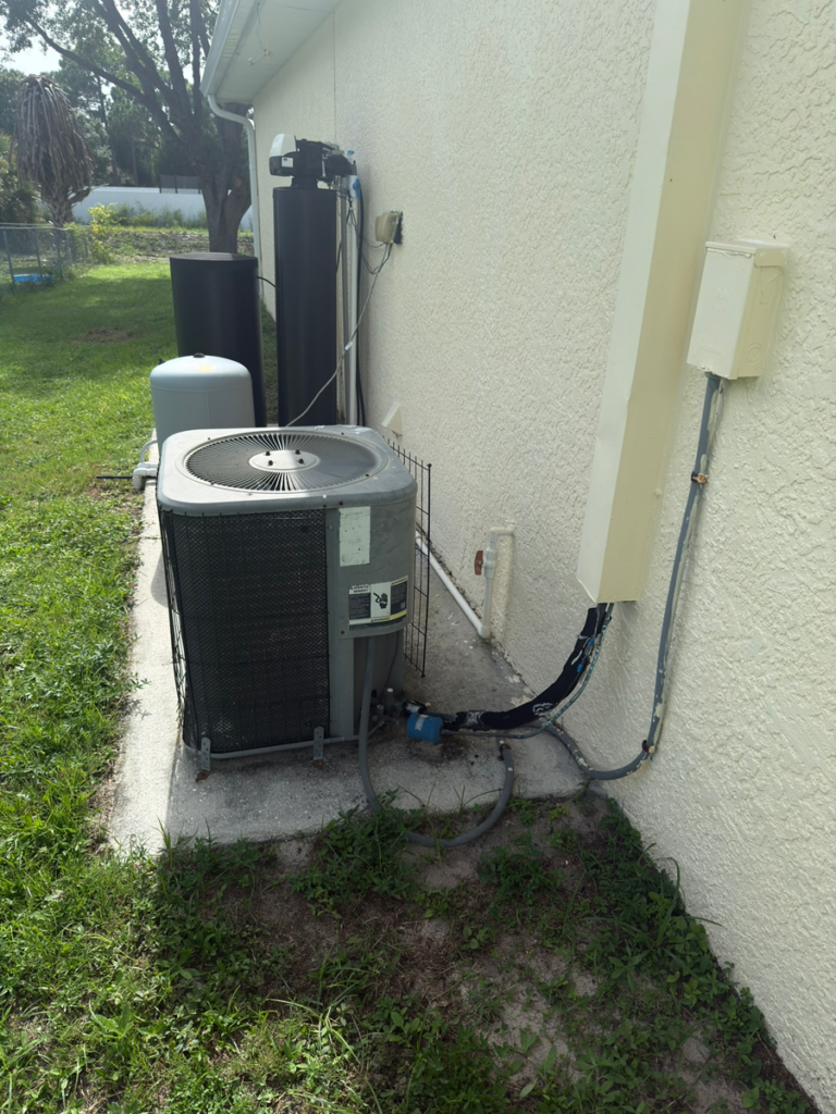 Before: the old outdoor AC condenser at a Fort Myers, FL home prior to replacement by Extreme Temp