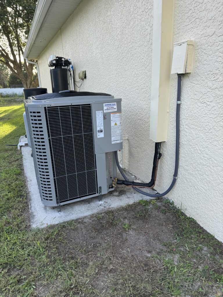 After: new high-efficiency outdoor AC condenser installed by Extreme Temp at a Fort Myers, FL home