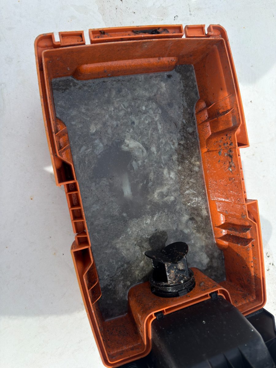 Wet-vac canister full of slime and sludge vacuumed out of an AC air handler drain pan by Extreme Temp Air Conditioning & Heating in Southwest Florida