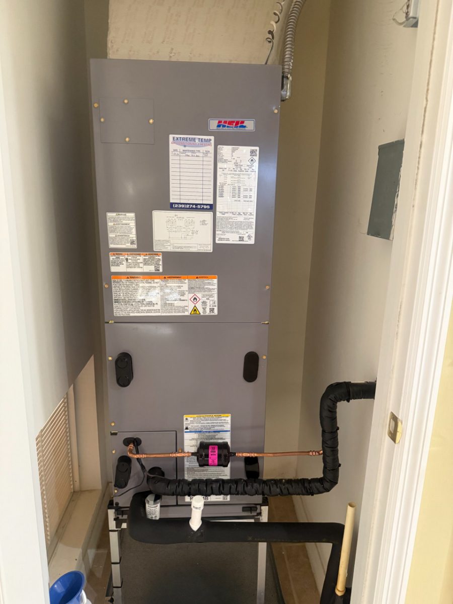 New air handler installed in a hallway closet with insulated refrigerant lines, part of an AC replacement by Extreme Temp in Southwest Florida