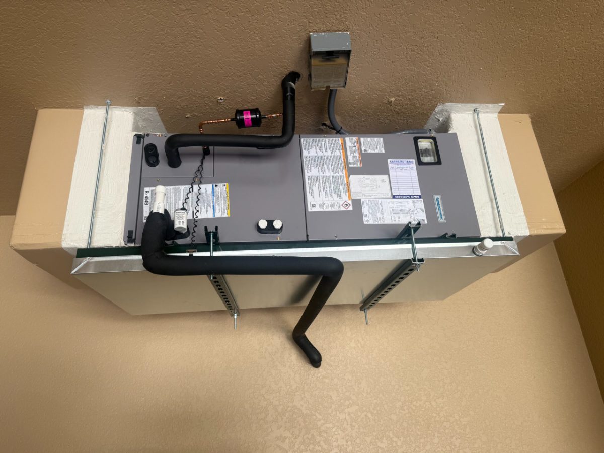 New horizontal air handler with a clean condensate drain and line-set install, part of an AC replacement by Extreme Temp in Southwest Florida
